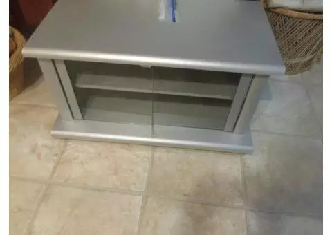 SILVER GRAY T V STAND WITH GLASS DOORS